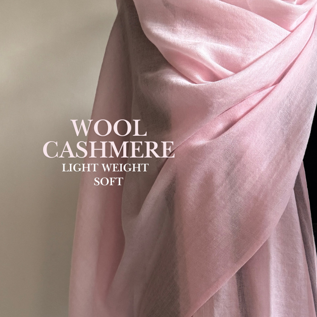 Light pink wool cashmere stole wrapped elegantly soft and lightweight texture