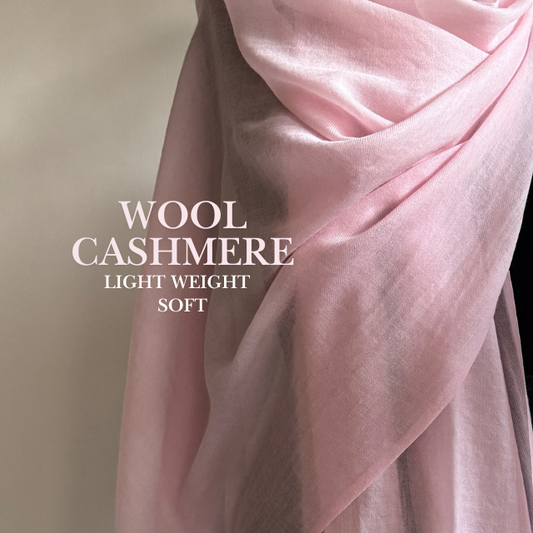 Light pink wool cashmere stole wrapped elegantly soft and lightweight texture